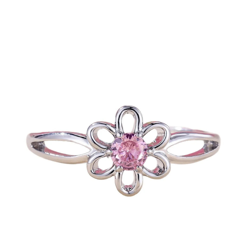 Copper flower hollow-out fashion ring for women with platinum pink diamond plating.