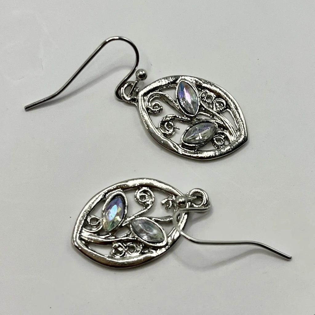 Women's silver colour leaves-shaped earrings with embedded moonstone stones and botanical design