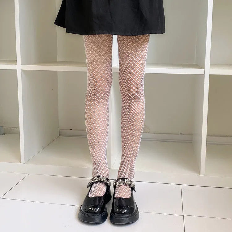Women's mesh stockings showing large, medium, and small net patterns in black and white colours