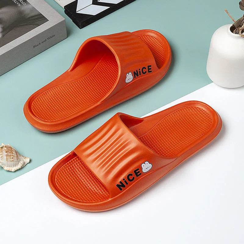 Pair of minimalist EVA flip flop slippers in a choice of six colours, showing the injection moulded non-slip sole.