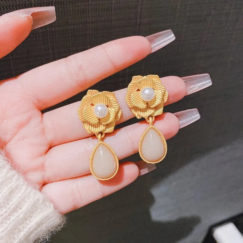 Gold electroplated alloy stud earrings with opal stone and Hong Kong style floral design featuring needle rose pearl and ice flower elements