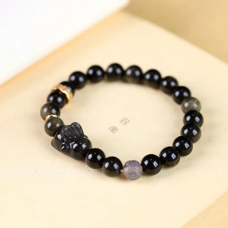 Handmade obsidian bracelet with lying rabbit silver charm and grey agate beads in 8mm and 10mm sizes
