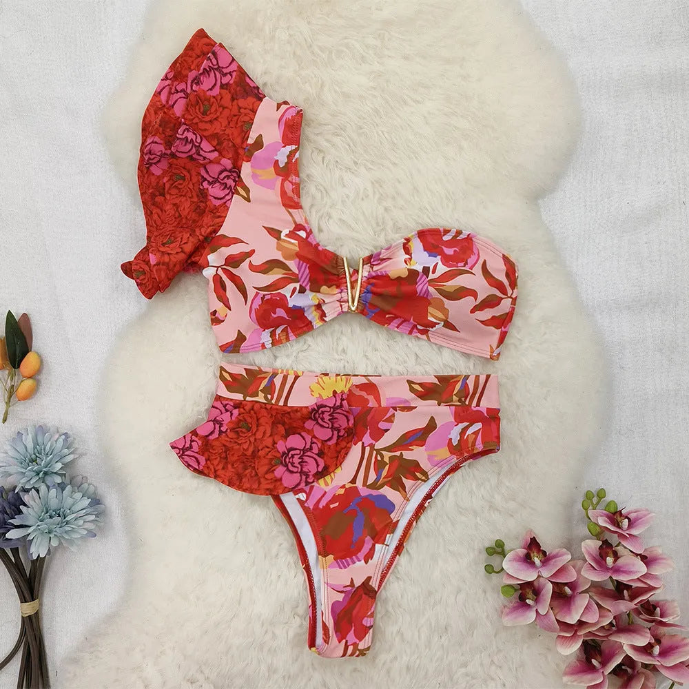 Pink floral print one-shoulder women's bikini swimsuit with high-waist briefs and ruffle trim