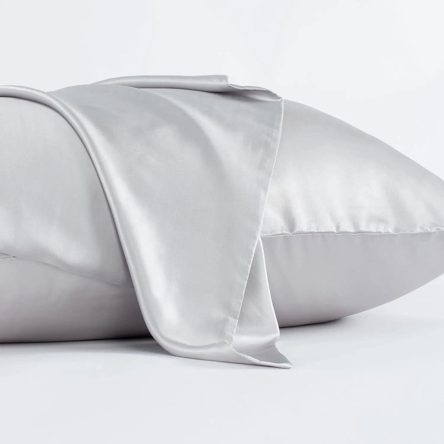 Dark grey 19 momme mulberry silk pillowcase with an envelope closure, laid flat.