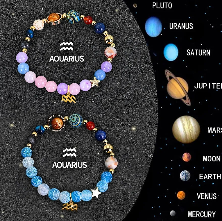 Set of two natural stone beaded bracelets with zodiac sign charms on a white background.