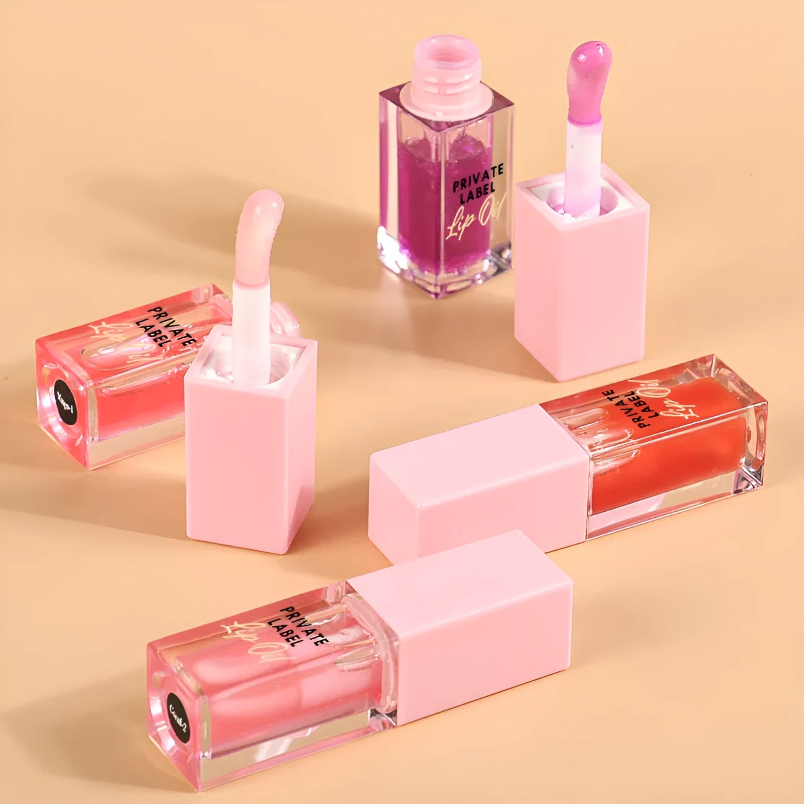 Six transparent lip gloss tubes in fruity flavours: bird of paradise, cherry, coral, mango, strawberry, watermelon