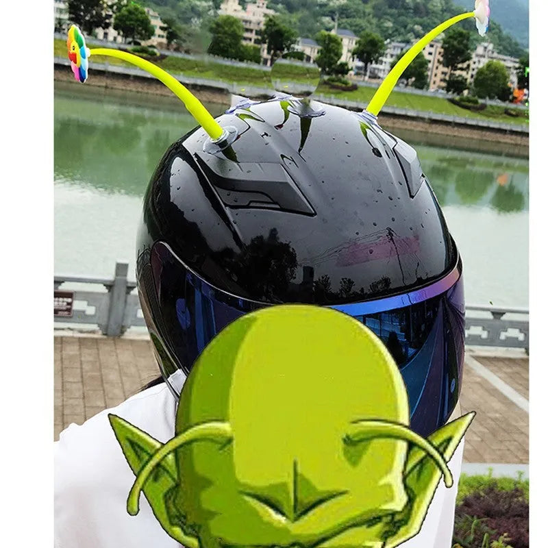 Yellow silicone sunflower decoration with suction cup for attaching to a helmet.