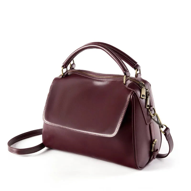 Genuine leather crossbody tote bag in a cross square shape with double straps and internal organiser pockets.