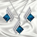 Ladies necklace and earring set with alloy pendant on cross chain, glass accents, electroplated finish
