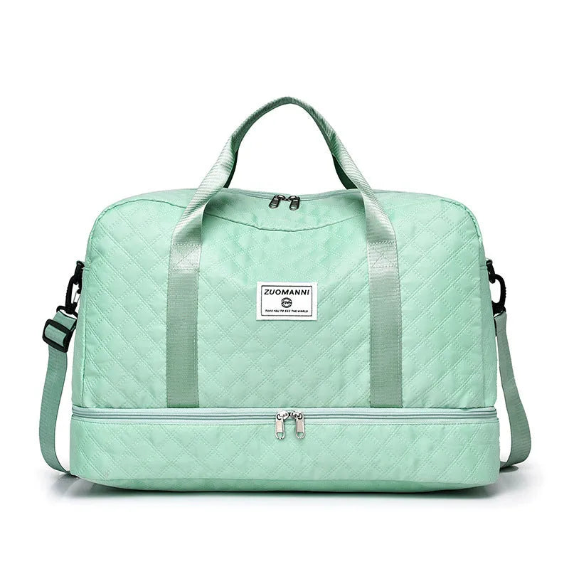 Large Oxford cloth travel bag with 36-55 litre capacity shown in haze blue colour