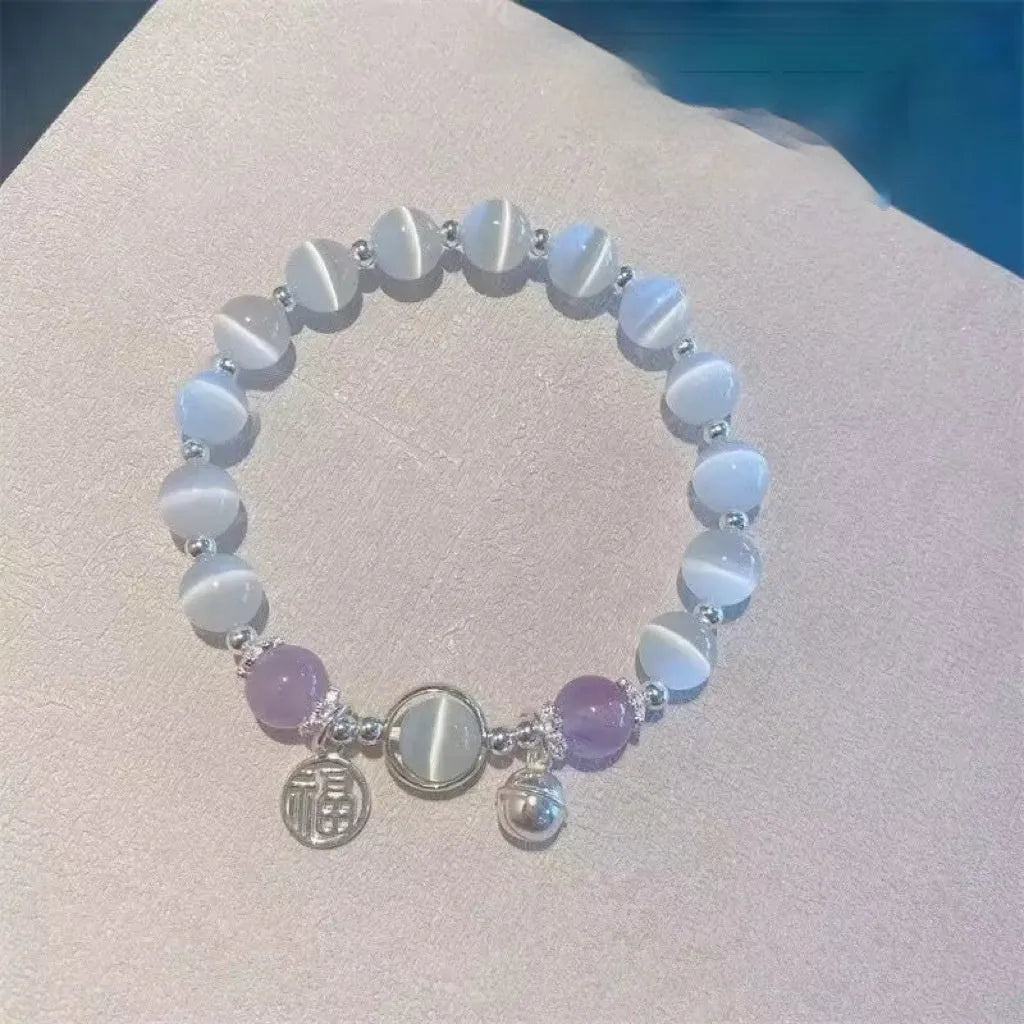 Handmade glass butterfly charm bracelet for women in a drop shape with round details.