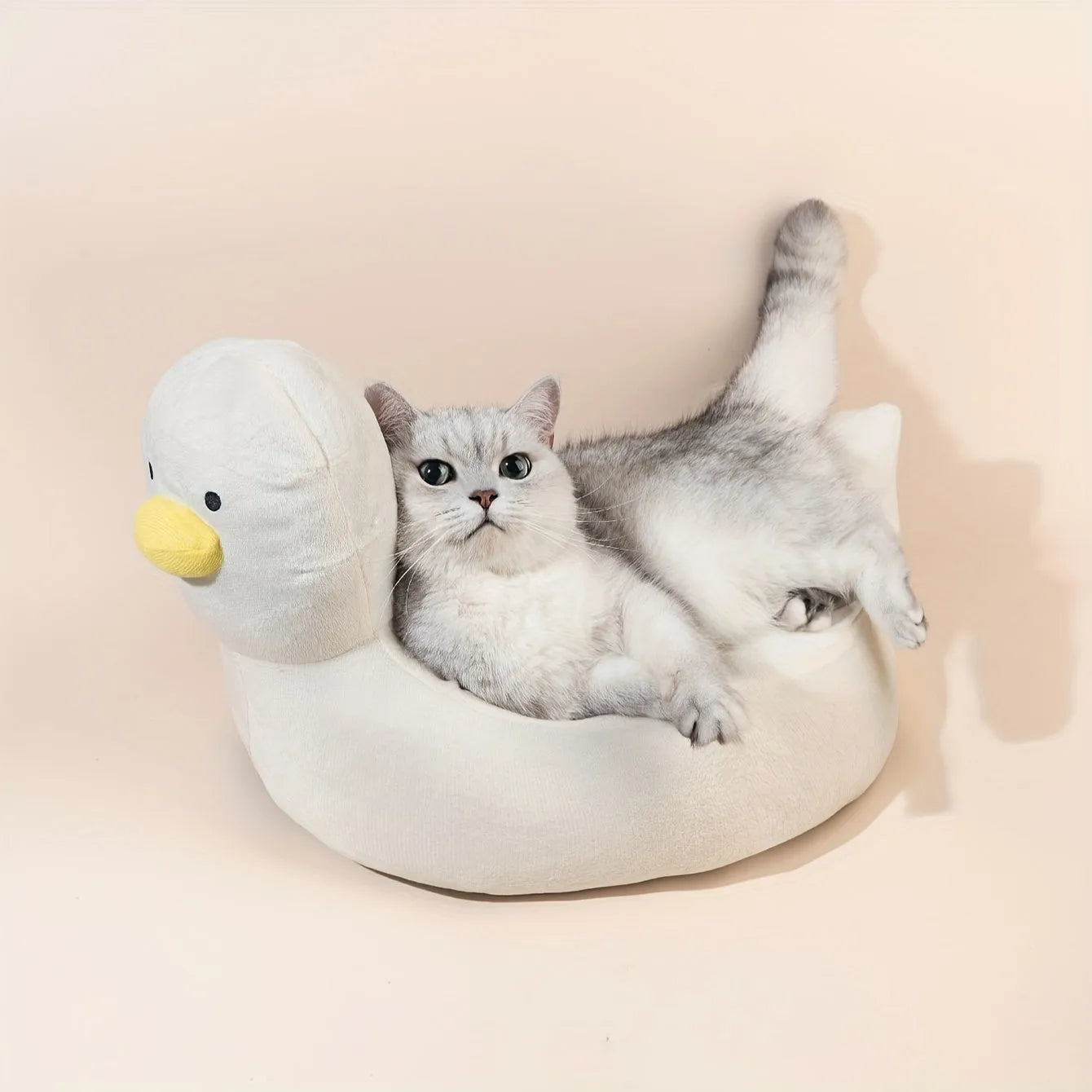 Blue duck-shaped pet bed sofa for small dogs and cats on white background