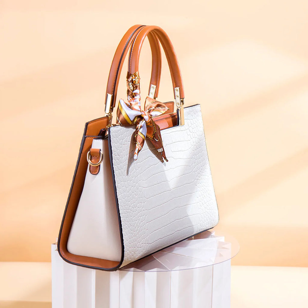 Milky white women's large square shoulder handbag made of PU with visible stitching and an external slit pocket.