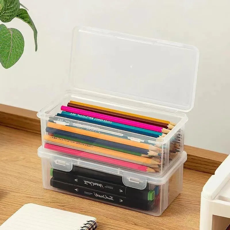 Clear transparent large pencil storage box filled with colouring pencils and crayons