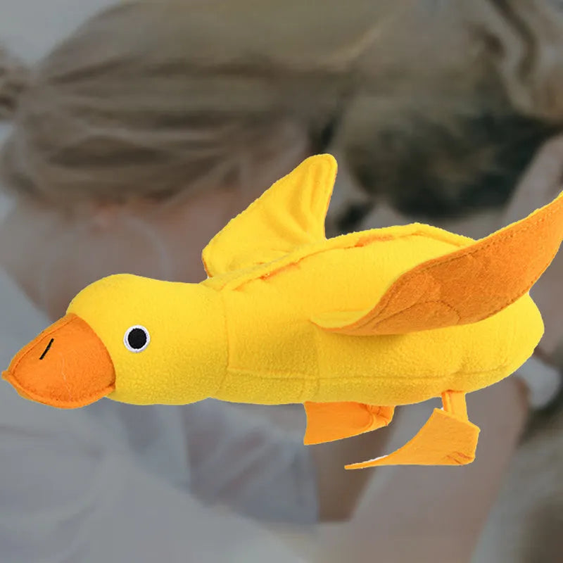 Yellow teddy dog toy with an attached duck doll, showing integrated food leak pockets for treats.