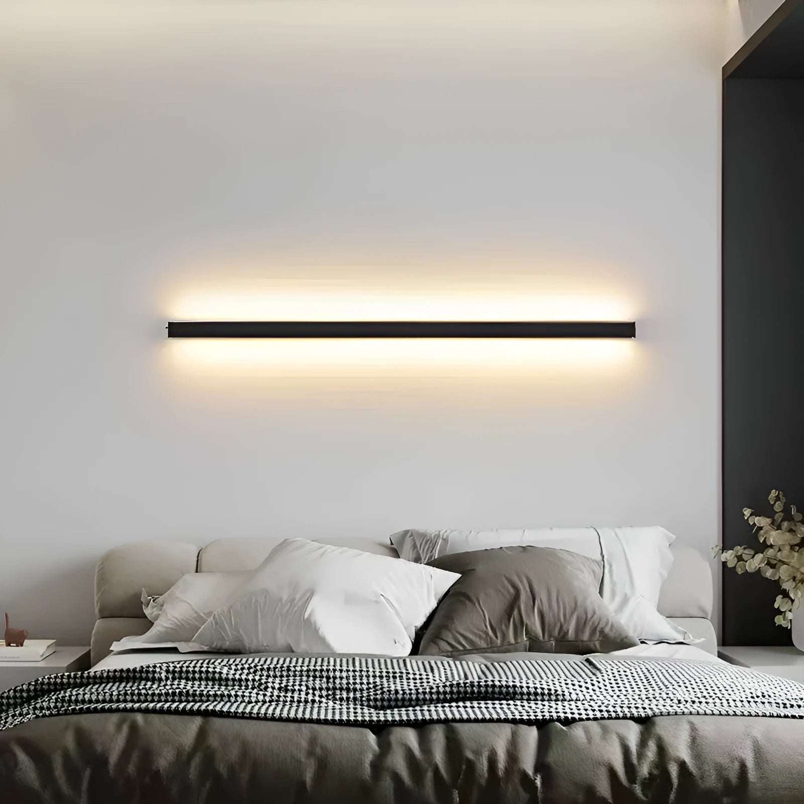 80cm long black aluminium LED strip wall lamp mounted on a wall, showcasing its simple linear design.