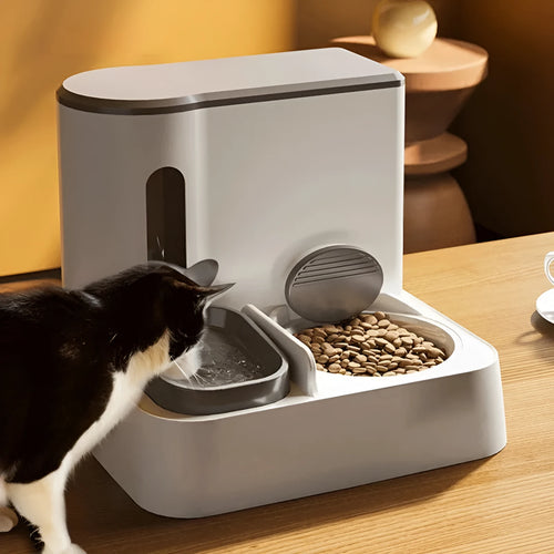 Grey automatic cat feeder and water dispenser double bowl unit on floor
