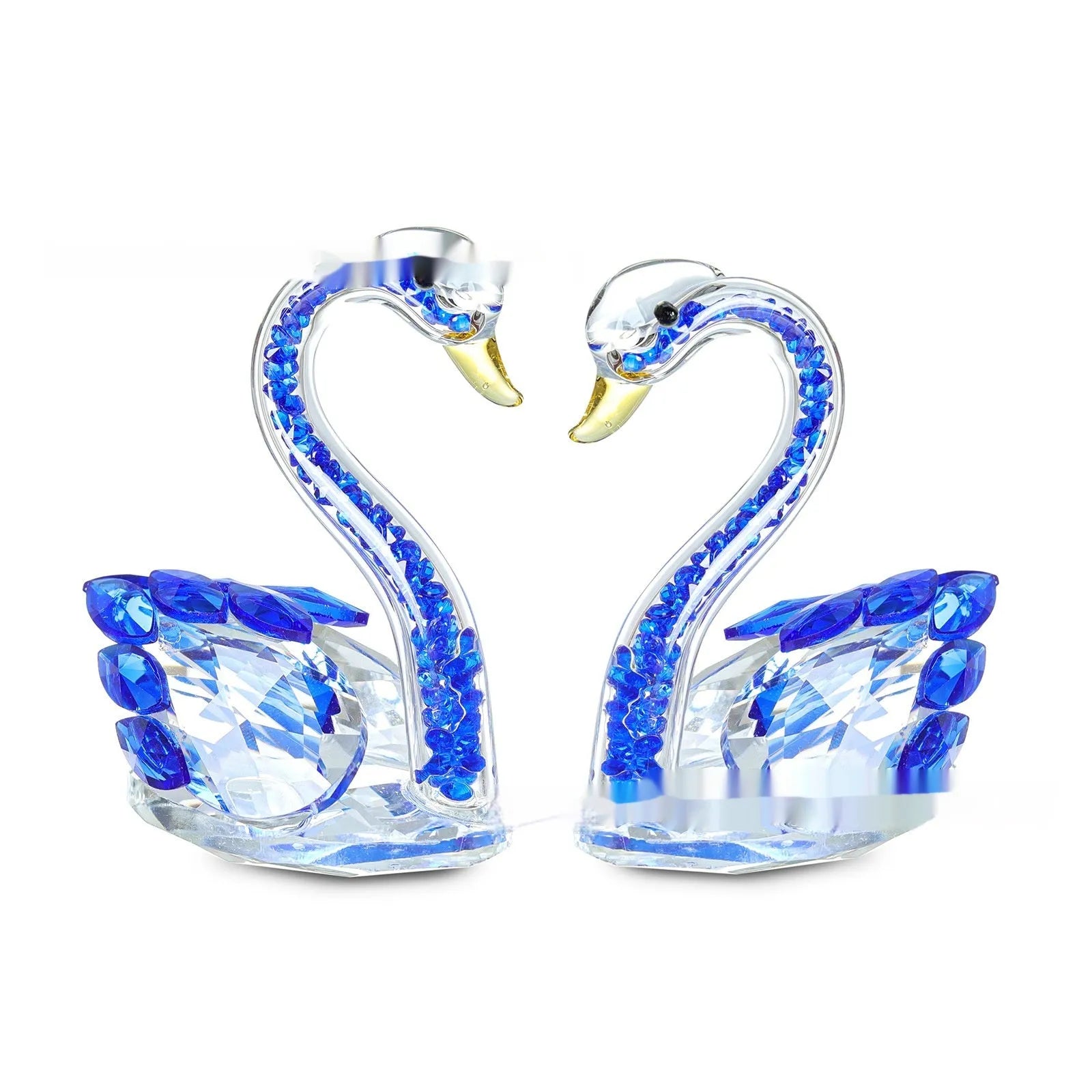 Crystal swan desktop ornament in red, blue, pink, or purple on a wooden surface.