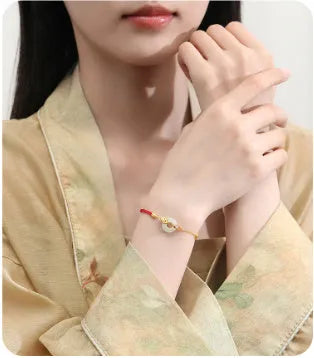 Koi peace buckle hetian jade red rope bracelet in 925 silver with gold electroplated finish