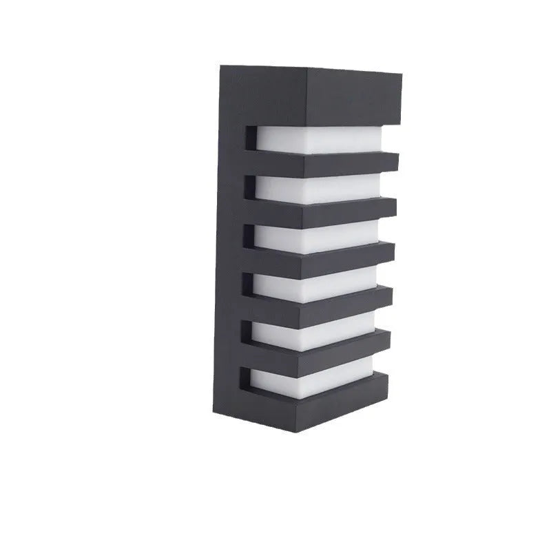 Modern minimalist outdoor wall lamp with aluminium shell, shown mounted on an exterior wall.