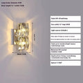Crystal wall lamp with stainless steel frame in gold or chrome finish, mounted on a wall.