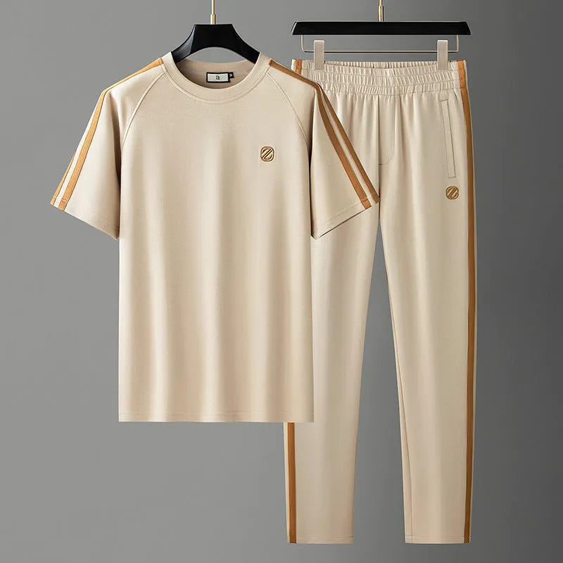 Men's blue ice silk style short sleeve suit set with matching trousers on a hanger