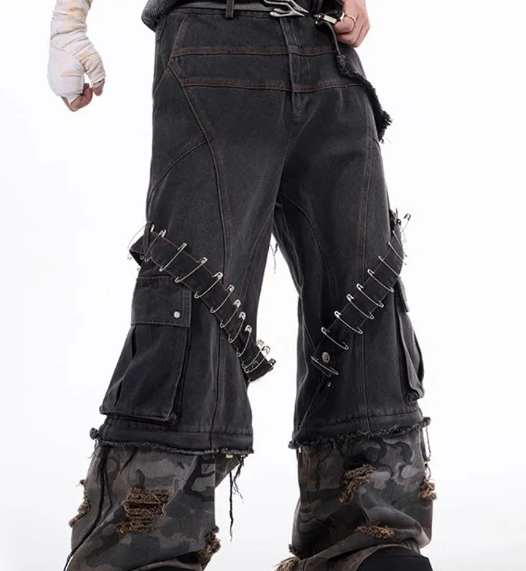 Men's grey cotton jeans with a camouflage splicing pattern, pin accents, and ribbon trim details.