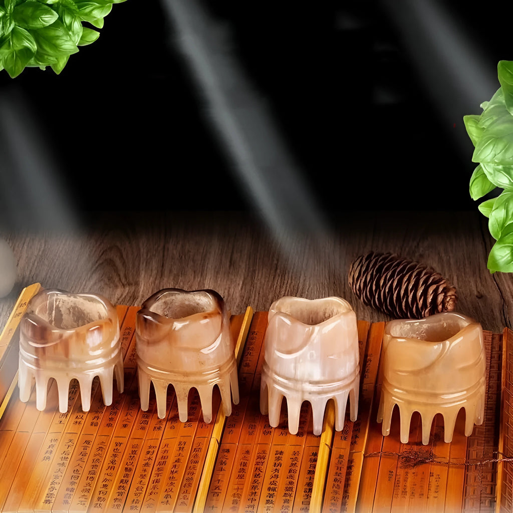 Black buffalo horn head massage comb with wide-tooth, pointed tip, and fine-tooth sections