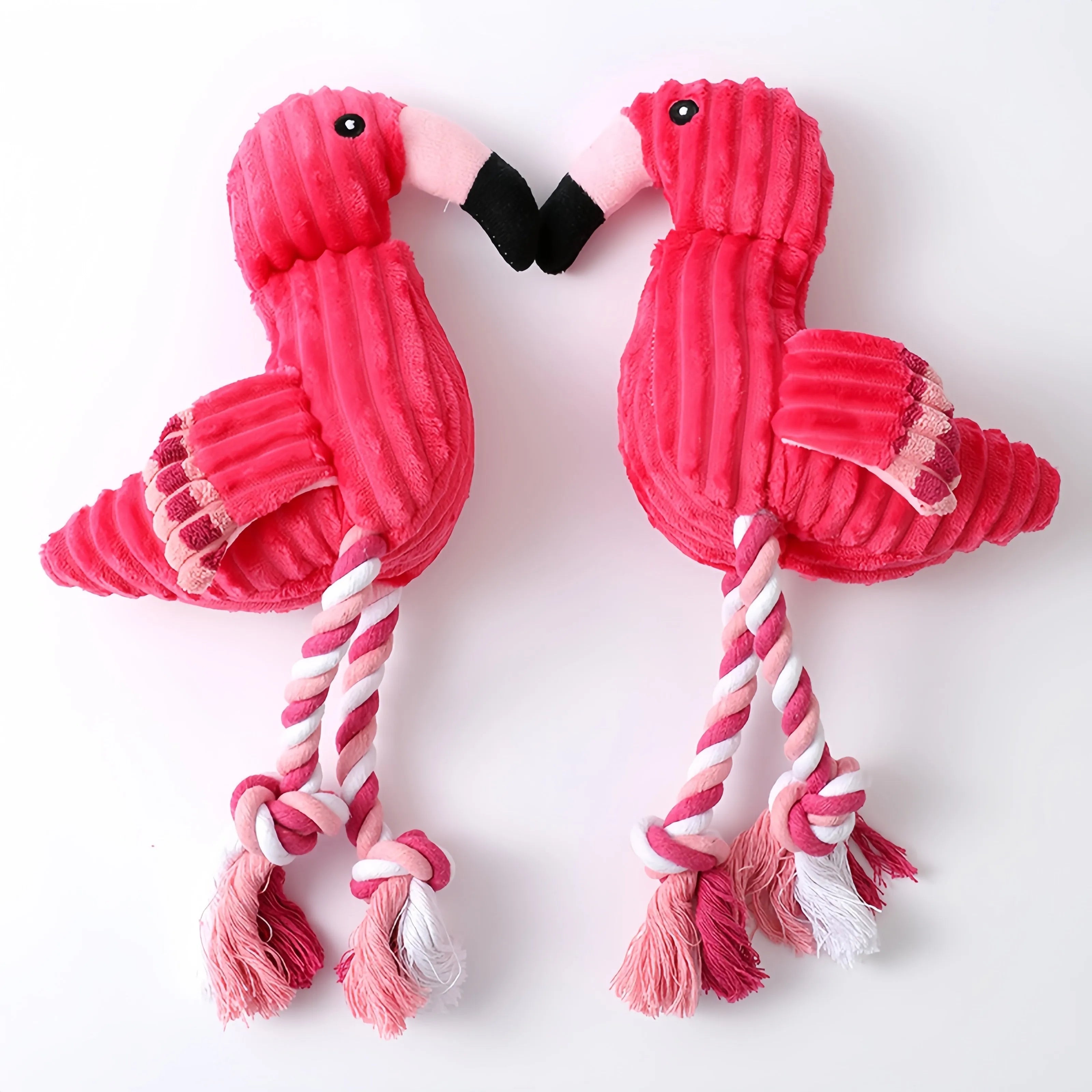 Pink corduroy animal-shaped squeaky plush dog toy on a plain background