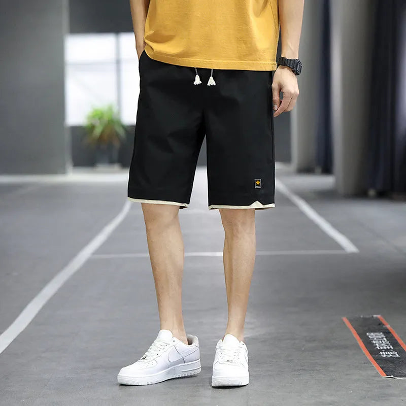Men's loose fit straight leg beach shorts in various colours with elastic waistband