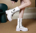 Black mid-calf women's knight boots with metal buckle and side zipper on a white background.