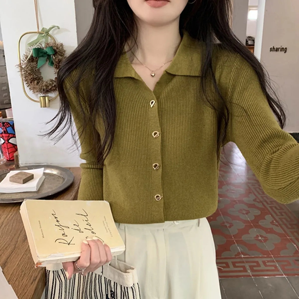 Loose fit beige viscose knitted cardigan with long sleeves, shown worn open.