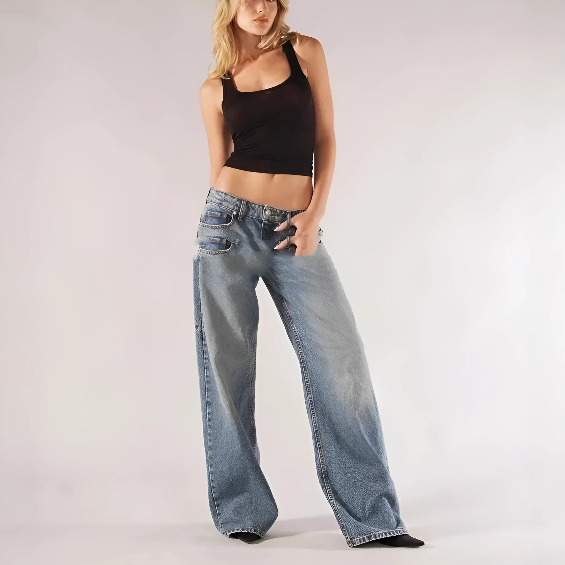 Women's blue cotton wide-leg mop trousers with a loose fit and low waist on a neutral background.