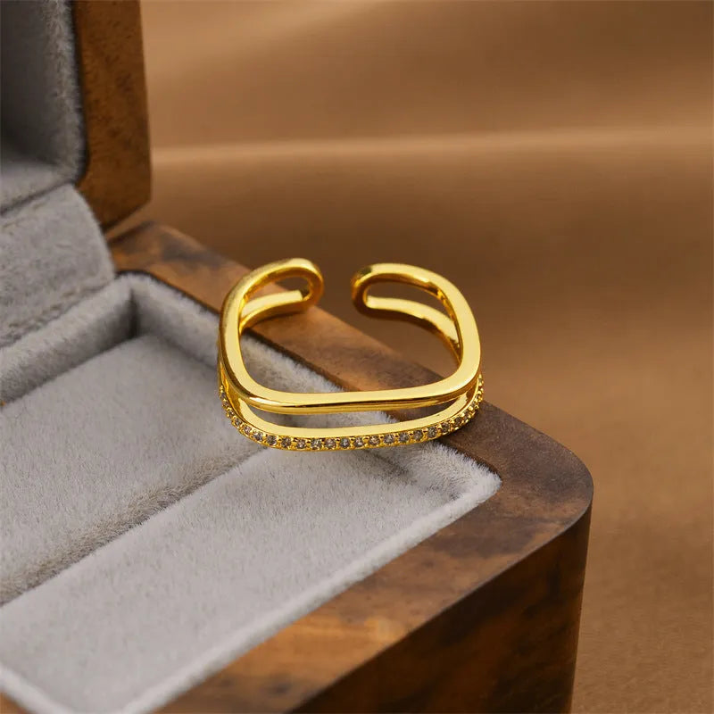 Gold geometric open adjustable women's ring showing Korean fashion design with electroplated finish