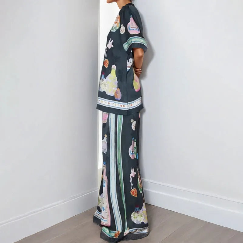 Black women's casual set with cartoon print cardigan top and matching trousers