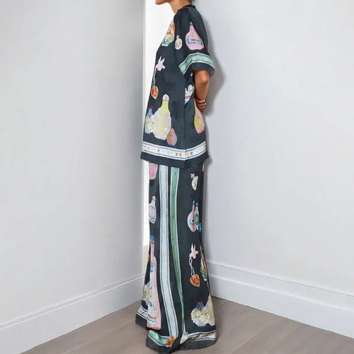 Black women's casual set with cartoon print cardigan top and matching trousers