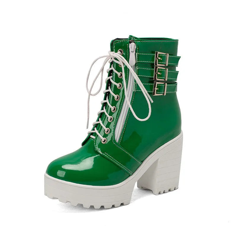 Women's black ankle boots with thick heel, round toe, and front lace-up on a waterproof platform sole.