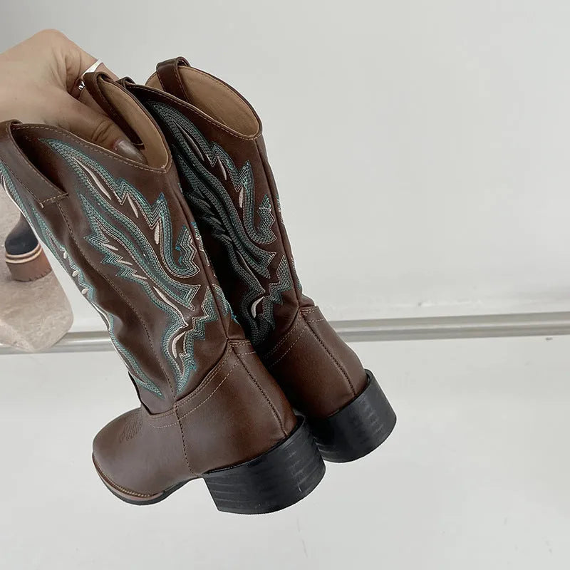Brown women's mid-calf Martin boots with embroidered pattern, leather lining, and a square rubber sole.
