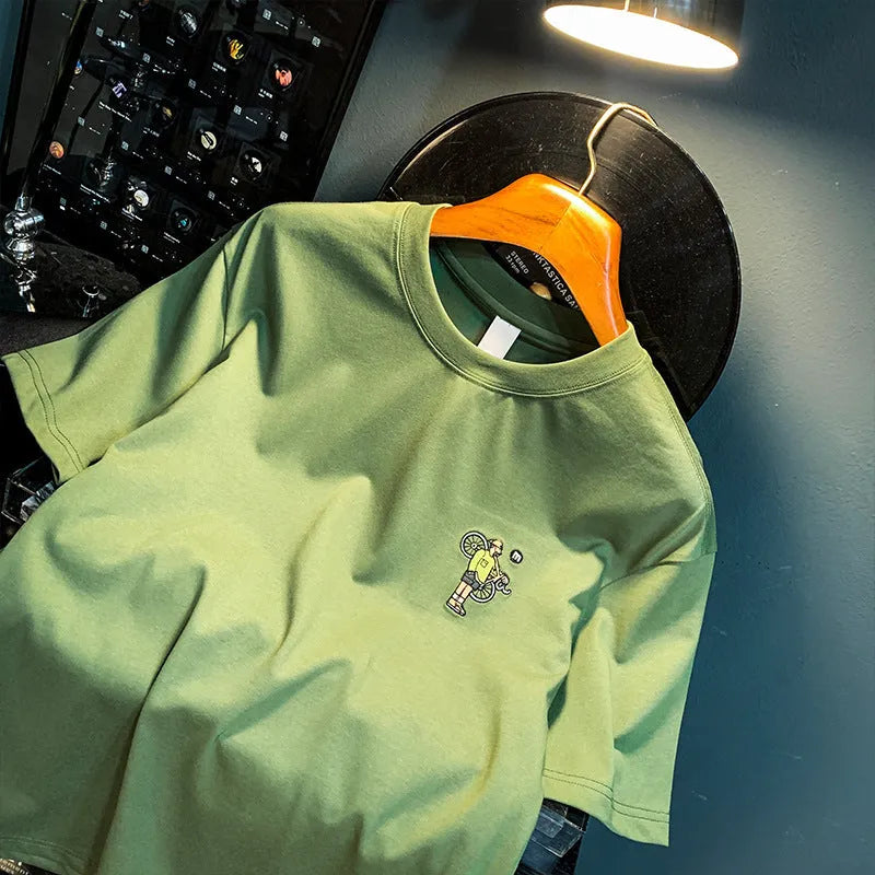 Green men's loose fit t-shirt with trendy printed design and short sleeves