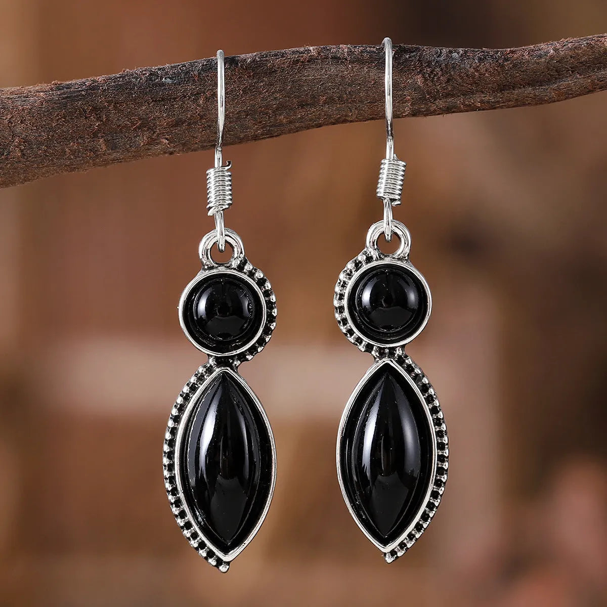 Black and purple geometric pendant earrings with round elements in vintage bohemian style