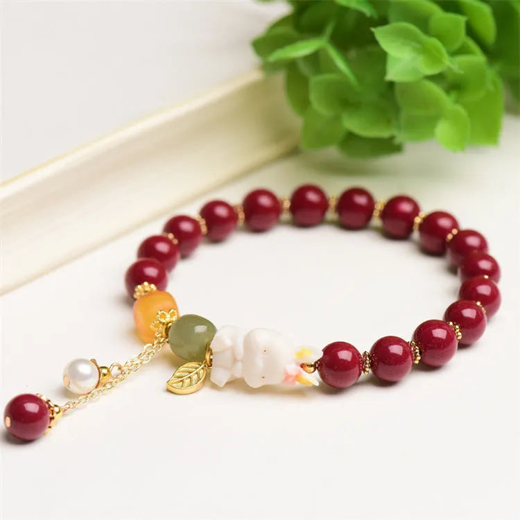 Natural beeswax purple gold sand bracelet with a detailed hand-carved cinnabar rabbit charm.