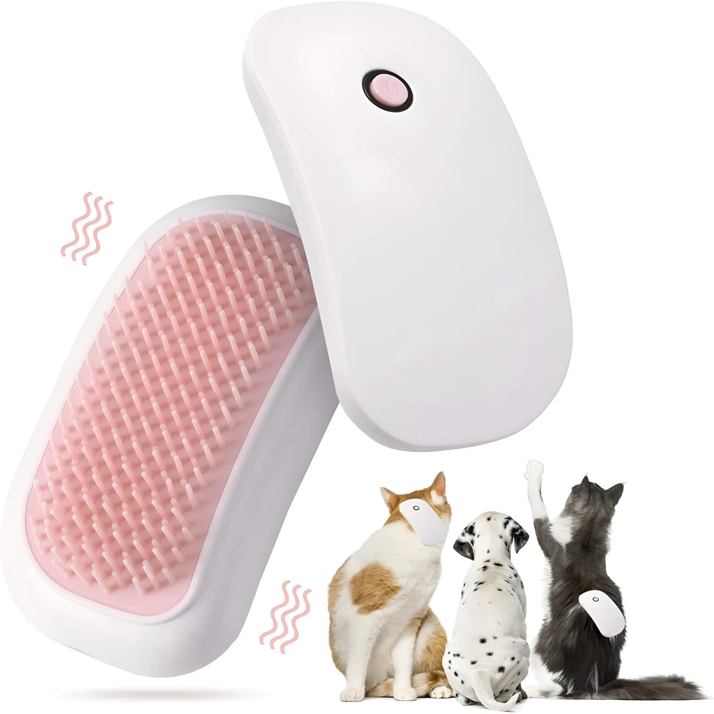 Handheld pink and white electric pet massage brush for cats and dogs on a table.