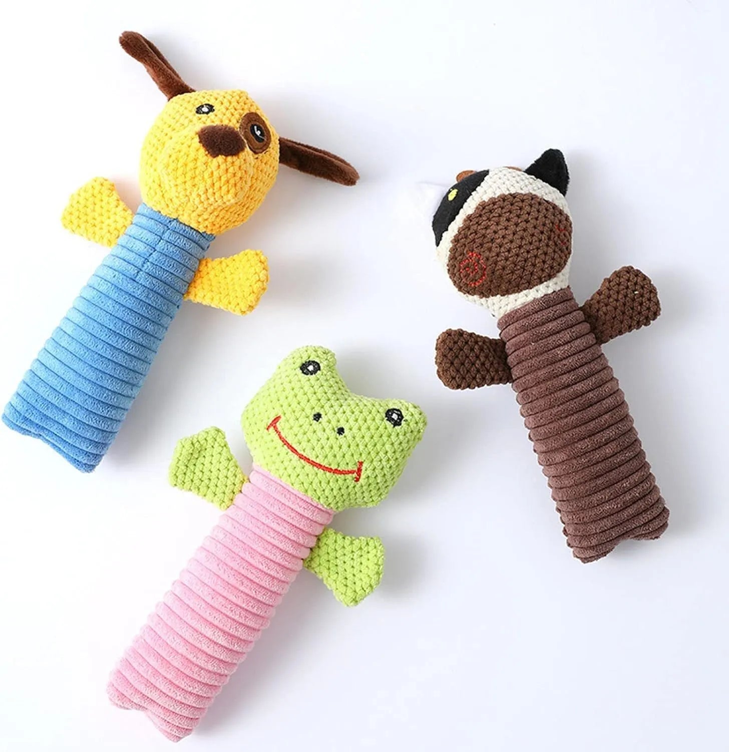 A cloth stuffed animal dog chew toy with a squeaker, shown next to a ruler measuring 19 cm in length.