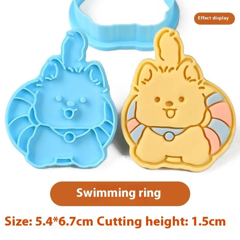 Three dimensional plastic biscuit mould showing puppy cartoon designs including birthday hats and swimming rings
