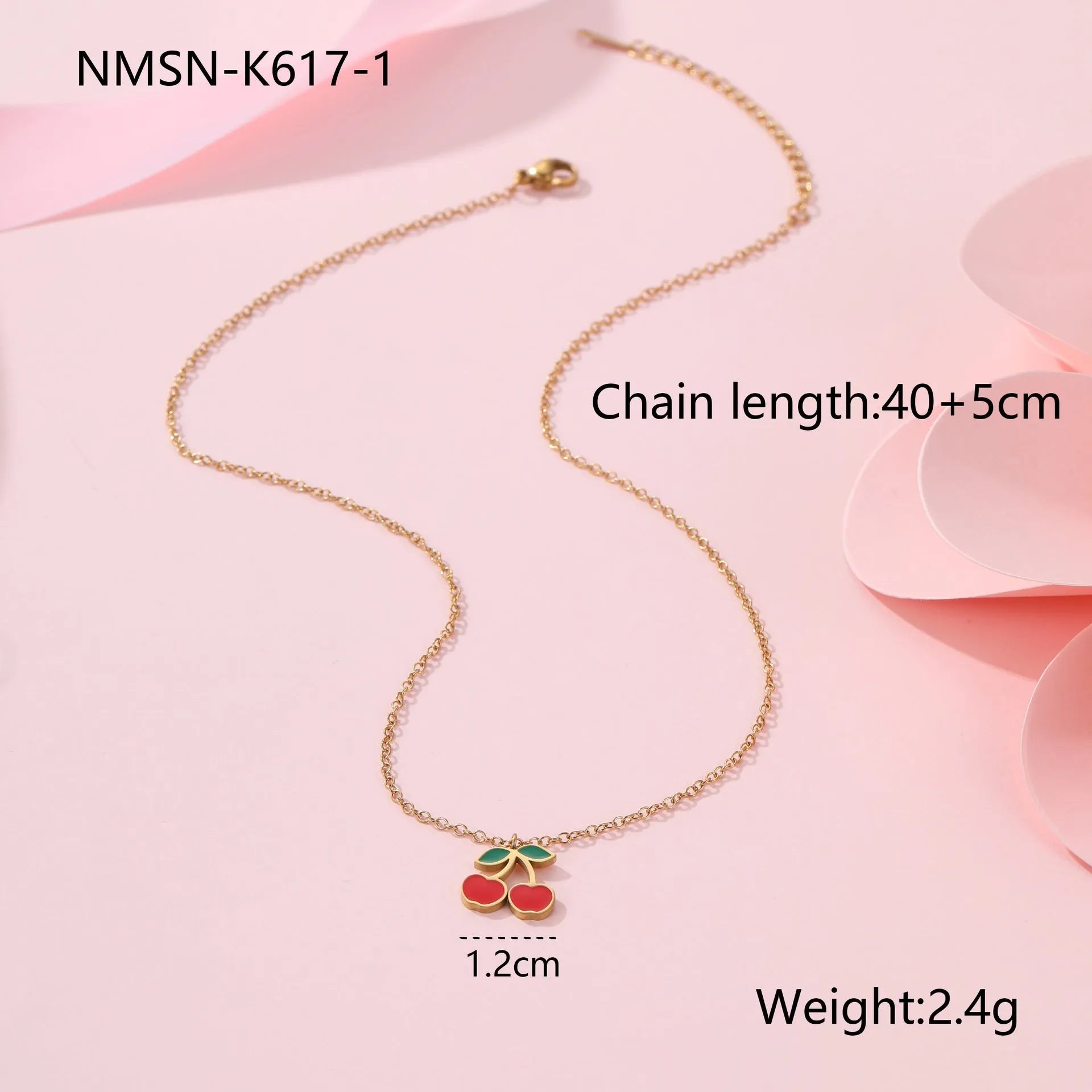 Cherry jewellery set showing necklace, bracelet, earrings, and ring with stainless steel construction and cherry fruit design