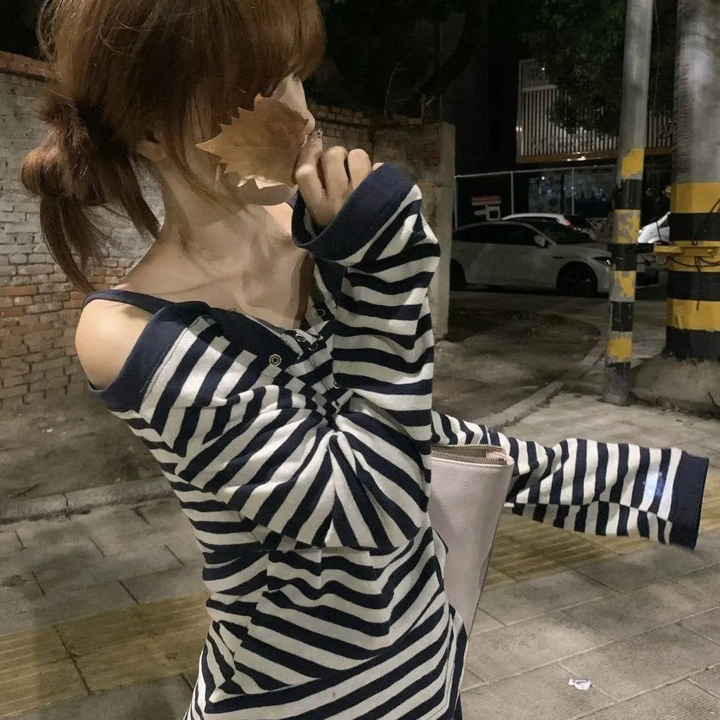 Dark blue Korean-style oversized women's long-sleeved t-shirt with embroidered stripes and button details.