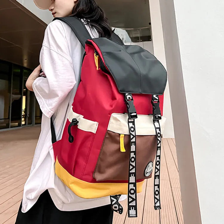 Oxford cloth backpack in black, green, or red with adjustable carrying straps.