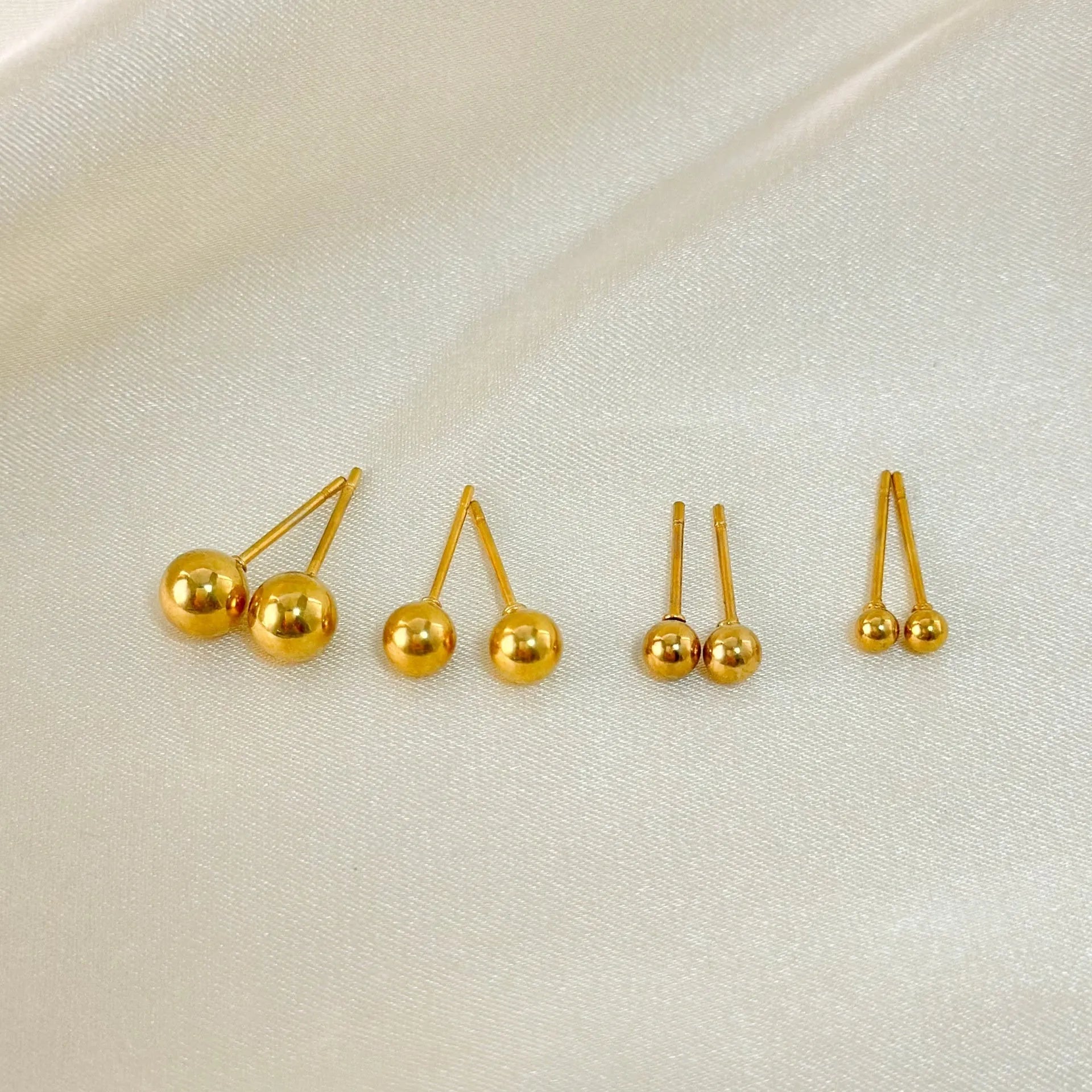 Stainless steel ball stud earrings in geometric round design with gold electroplating