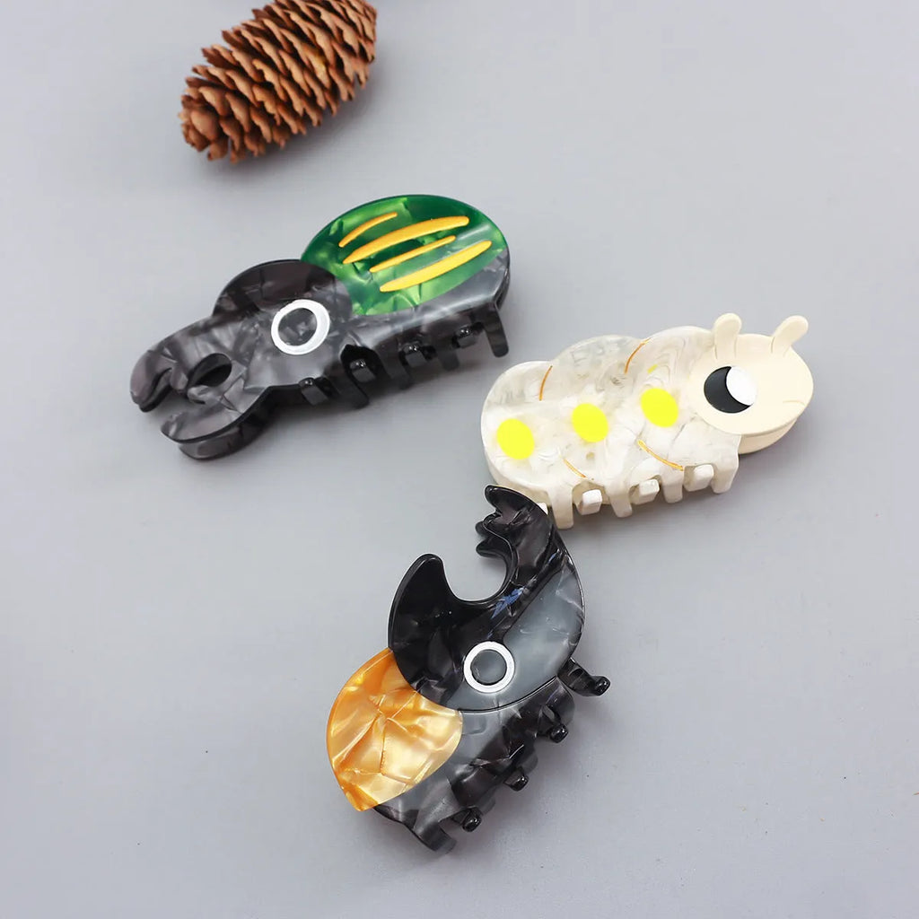 Handmade cellulose acetate insect biology beetle grip in green beetle design
