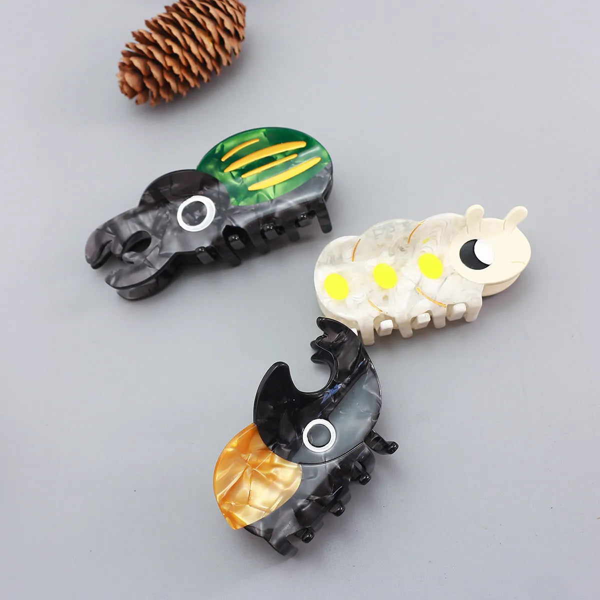 Handmade cellulose acetate insect biology beetle grip in green beetle design